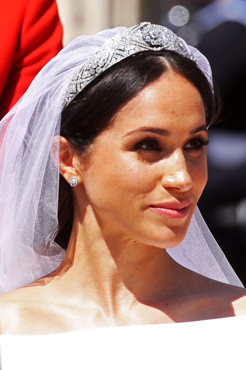 Meghan, Duchess of Sussex begins her carriage procession with Britain's Prince Harry, Duke of Sussex in the Ascot Landau Carriage after their wedding ceremony at St George's Chapel, Windsor Castle, in Windsor, on May 19, 2018. (Photo by CHRIS JACKSON / PO