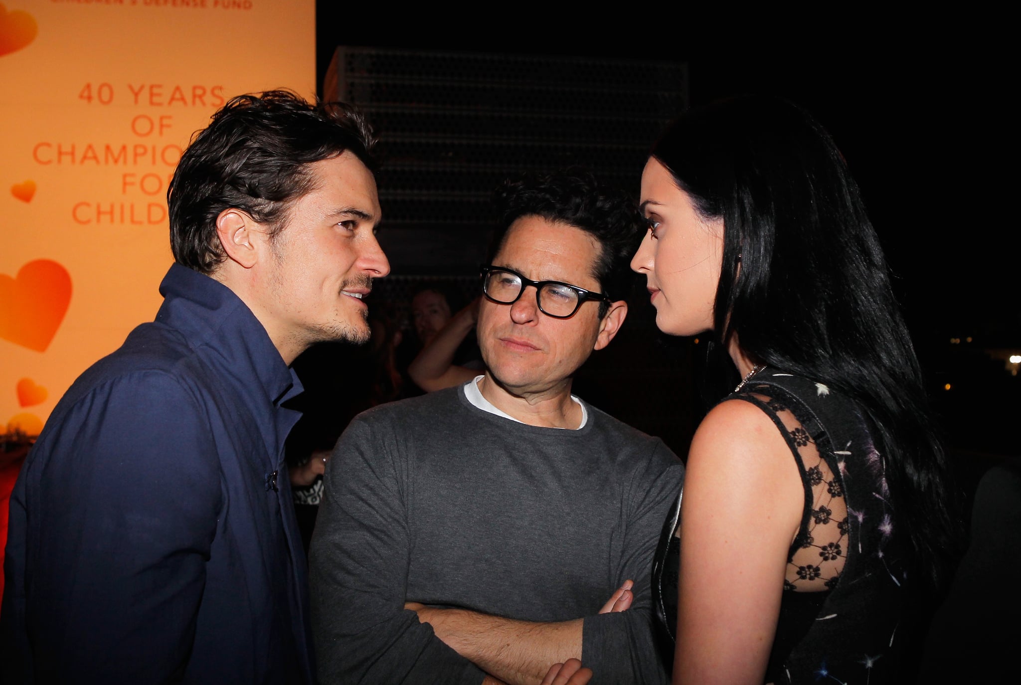 SANTA MONICA, CA - APRIL 10:  (l-R) Actor Orlando Bloom, host J.J. Abrams, and singer Katy Perry attend Coach's 3rd Annual Evening of Cocktails and Shopping to Benefit the Children's Defence Fund hosted by Katie McGrath, J.J. Abrams and Bryan Burk at Bad Robot on April 10, 2013 in Santa Monica, California.  (Photo by Donato Sardella/Getty Images for Coach)