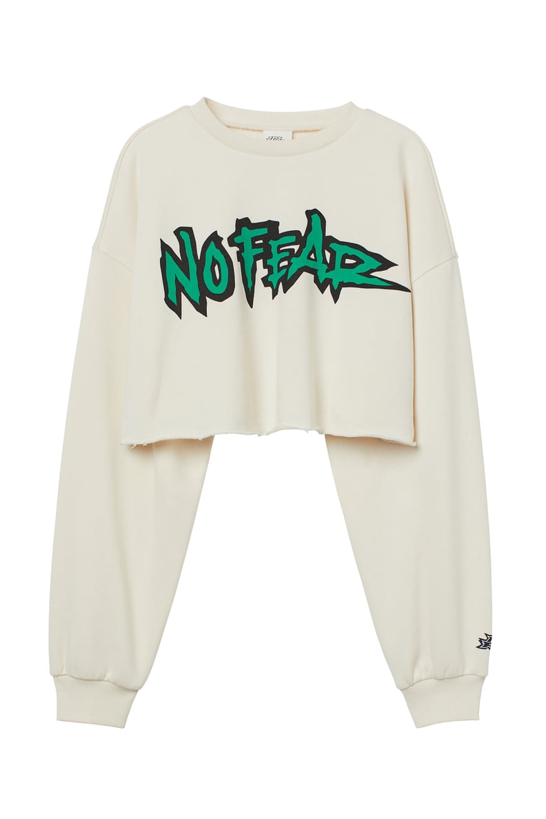A Cropped Sweatshirt: No Fear x H&M Short Printed Sweatshirt