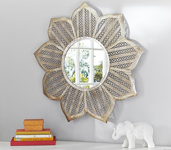 A silver flower mirror adds interest on the wall.