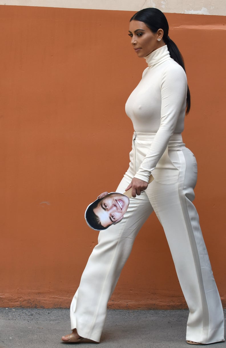 A cutout of Rob's face may be Kim's oddest accessory to date.