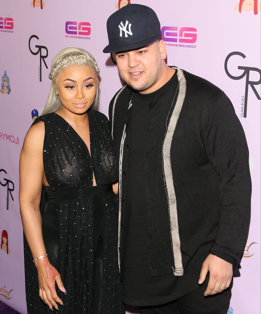 Rob Kardashian was firmly by Blac Chyna's side at an event celebrating her new ChyMoji app in LA on Tuesday night. The couple stayed close on the red carpet at the event, which also helped ring in Chyna's 28th birthday, which is on Wednesday. It's the first time we've seen Chyna and Rob at a public appearance together since they confirmed their relationship back in January. Rob popped the question in April, and just last week, Chyna revealed that they were expecting their first child together. 
The exciting announcement wasn't without its drama, however; a rep for Chyna told People that the "other half of her family" — ie the Kardashians — leaked her big news and that she was then forced to announce it. Keep reading to see photos of Rob and Chyna's first red carpet outing, then see more stars who are expecting babies this year.