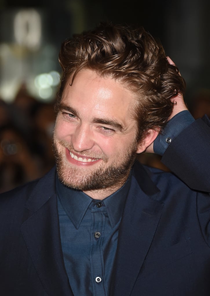 Rob was glowing with a hand on his head at the Toronto International Film Festival in September 2014.