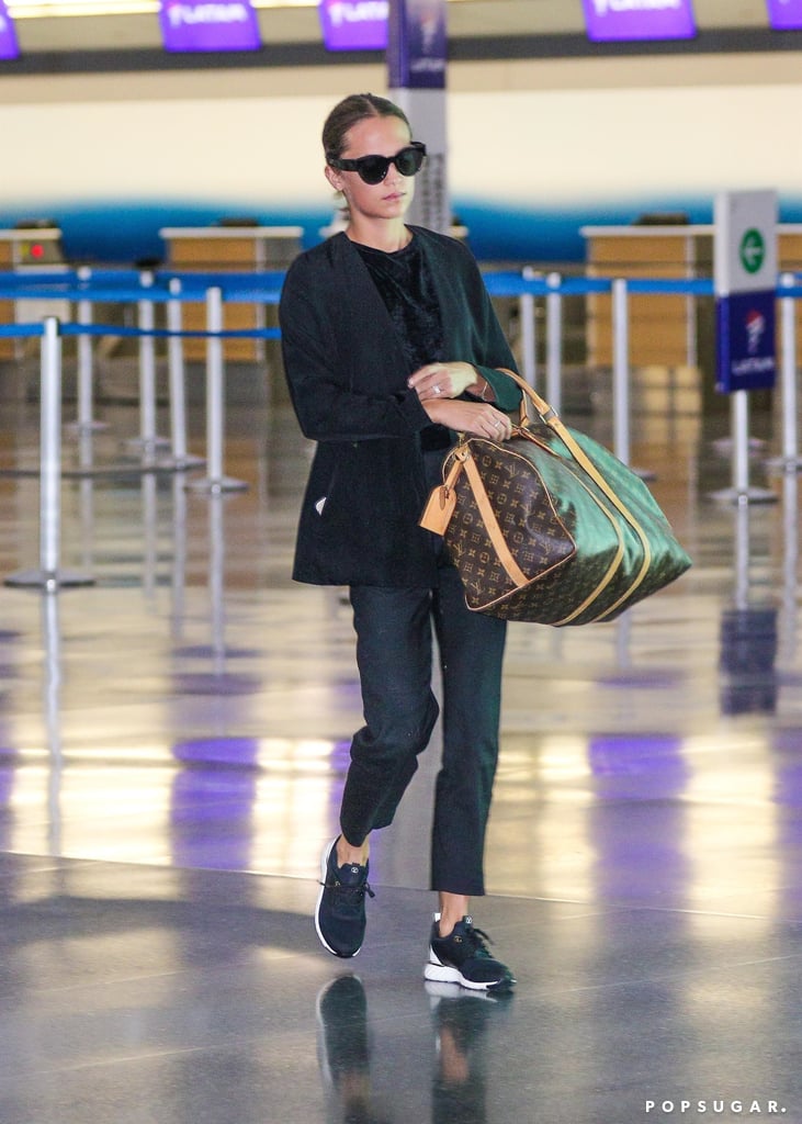 Styling a Black Cardigan With a Matching Shirt, Ankle-Length Jeans, and Sneakers