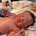 Baby Holding IUD in Birth Announcement