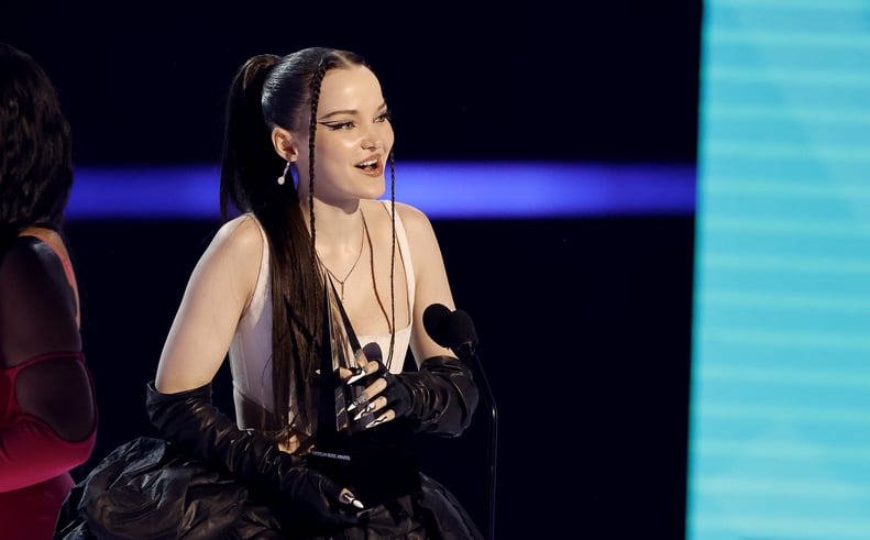 Dove Cameron dedicates new artist of the year award to the LGBTQ+ community at the 2022 American Music Awards.