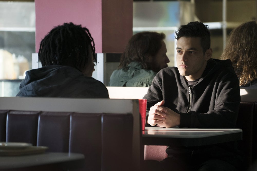 Rami Malek as Elliot.