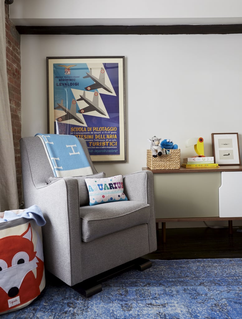 Two-year-old Sid's room is a wash of calming blues and grays. Within the color scheme is a cool vintage poster, the perfect nod to Jason and Jenny's love of art!