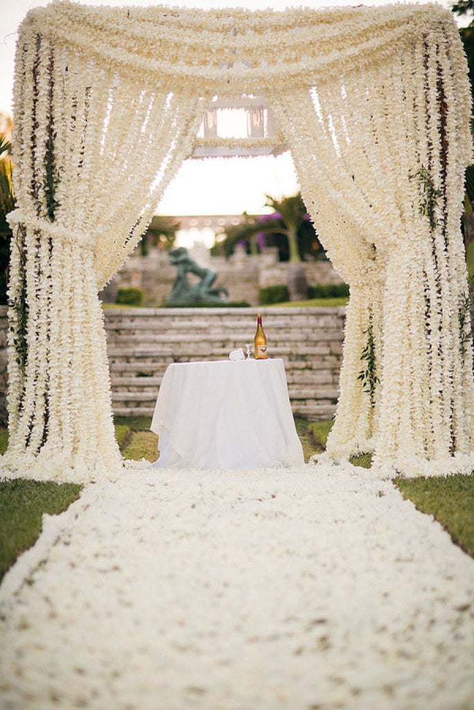 Outdoor weddings offer all sorts of possibilities for ceremony decor — especially when it comes to creative, unexpected altar alternatives. Whether you're into ornate, romantic archways or delicate DIY details, POPSUGAR Home is providing some of the most original backdrop ideas from across the web.
Photo by James Christianson via Style Me Pretty