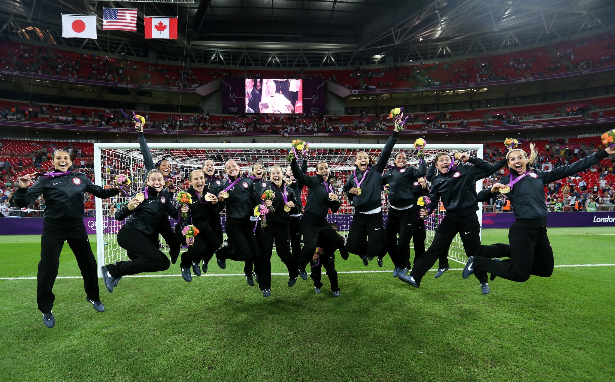 LONDON, ENGLAND - AUGUST 09:  The United States women's football team celebrates with the the gold medal after defeating Japan by a score of 2-1 to win the Women's Football gold medal match on Day 13 of the London 2012 Olympic Games at Wembley Stadium on August 9, 2012 in London, England.  (Photo by Julian Finney/Getty Images)