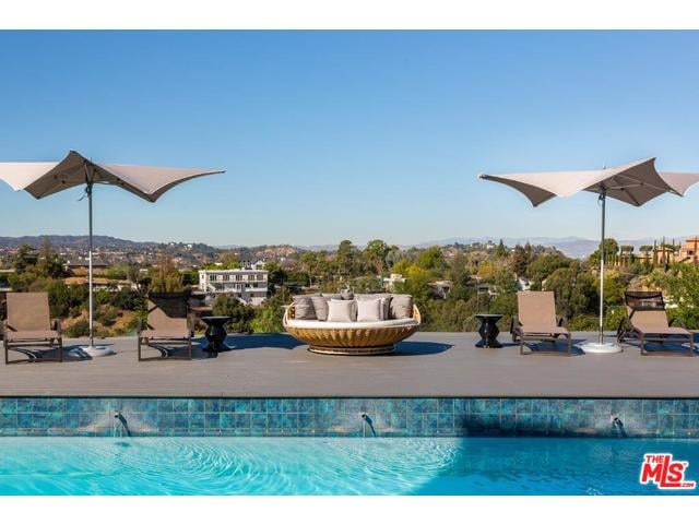 The couple's pool with a view can easily be mistaken for a resort.