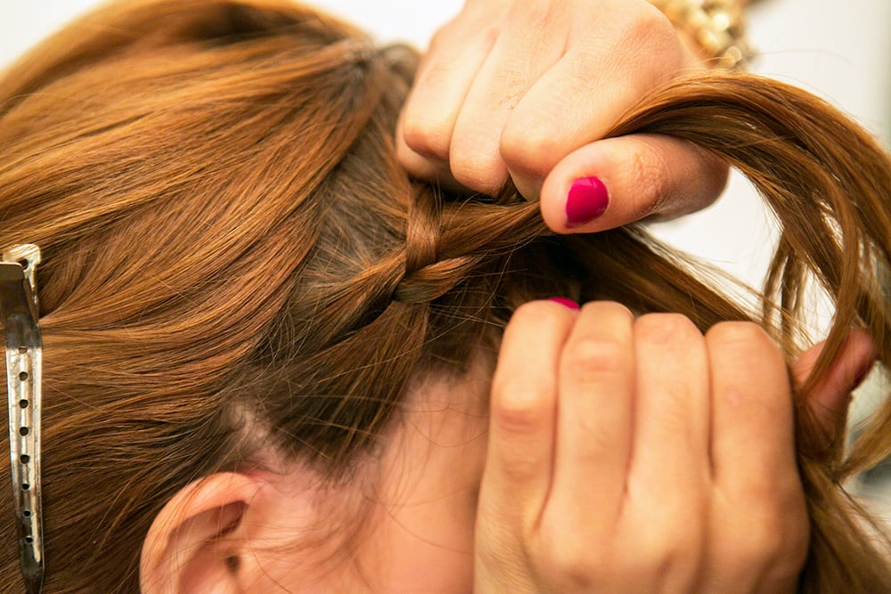 Continue to braid like a normal three-strand braid, adding in hair as you go along to create your woven headband.