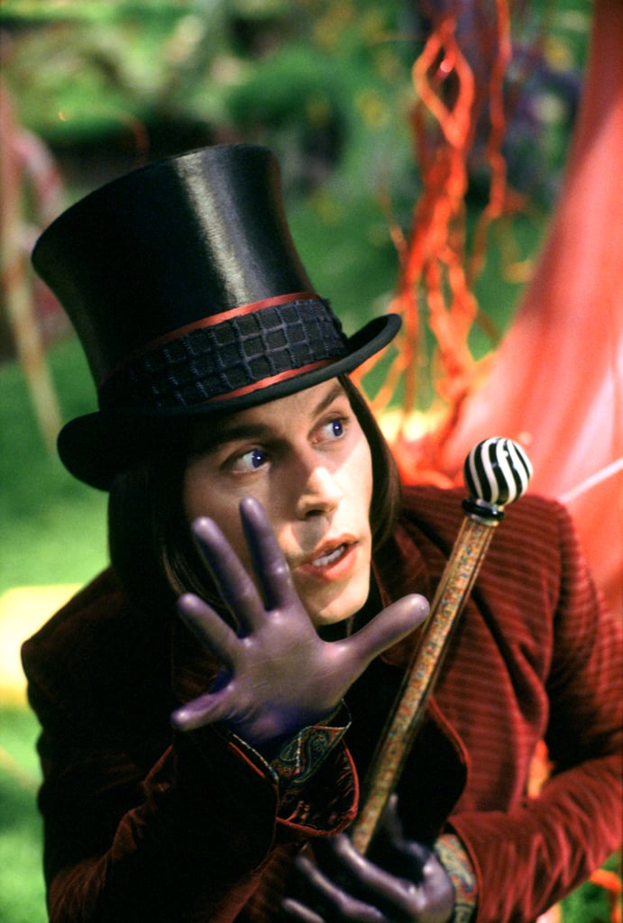 Oh, and we can't forget the plum-colored gloves that fit so tightly, they were like a second skin. Meanwhile, his top hat was black instead of brown and had two stripes that matched his coat.