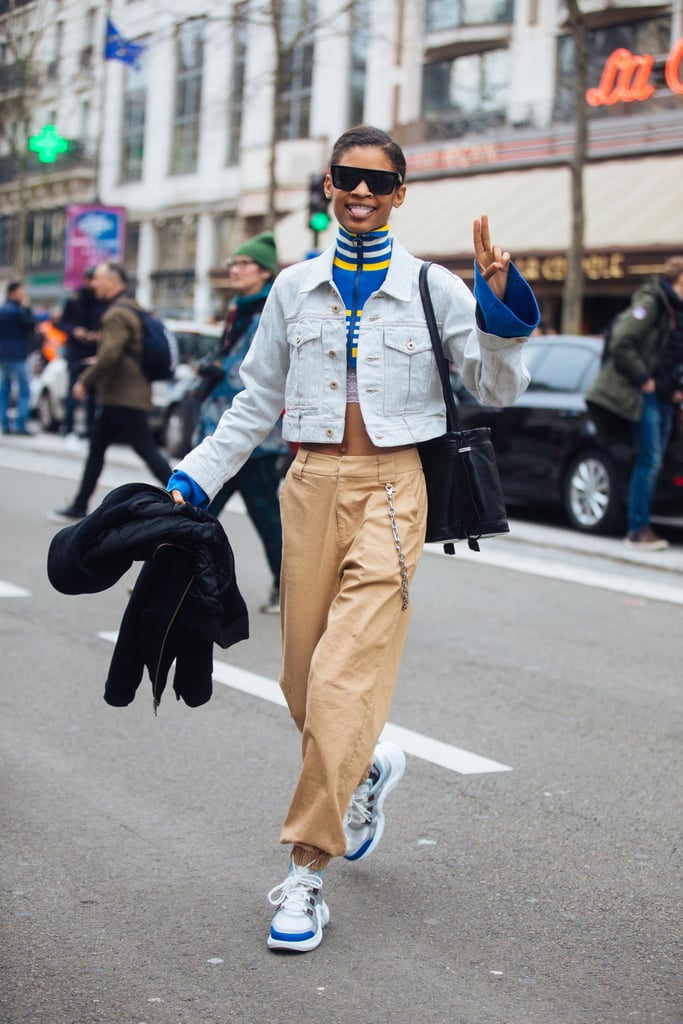 What's cooler than a denim jacket with low-slug trousers, a colorful knit, and chunky sneakers?