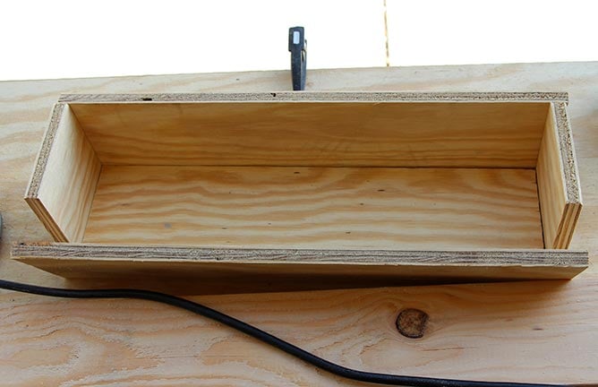 Basically, it's like a really simple puzzle to get the rest of the sides together, with some pieces the same length as the base and some 1/2 inch longer. We plan on making a few more of these shelves, and if we do, we'll update this post with specific cut lists if anyone is interested and hates math.