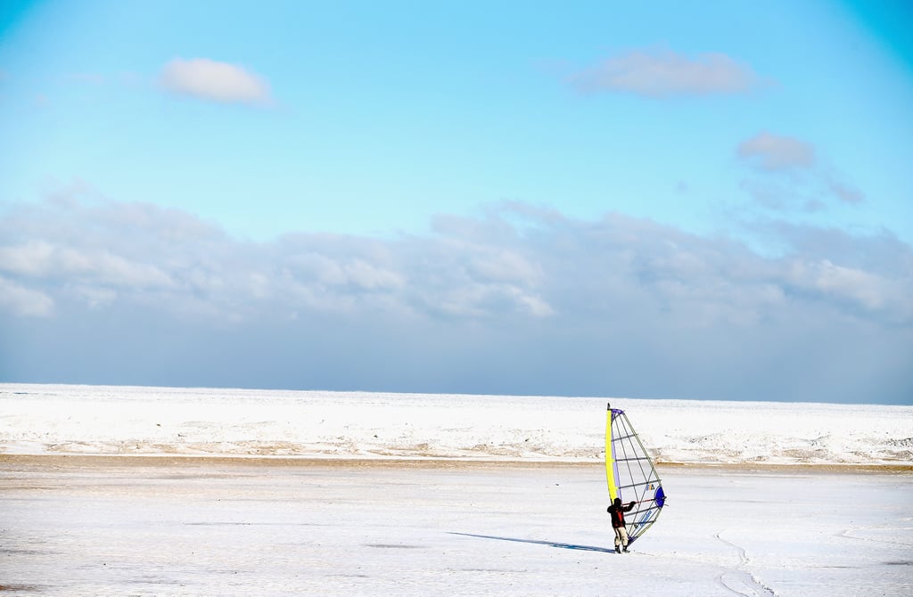 In Chicago, a man used a sail to ski along Montrose Beach on the shore of Lake Michigan.