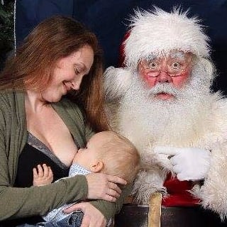 Mom Breastfeeds Son on Santa's Lap