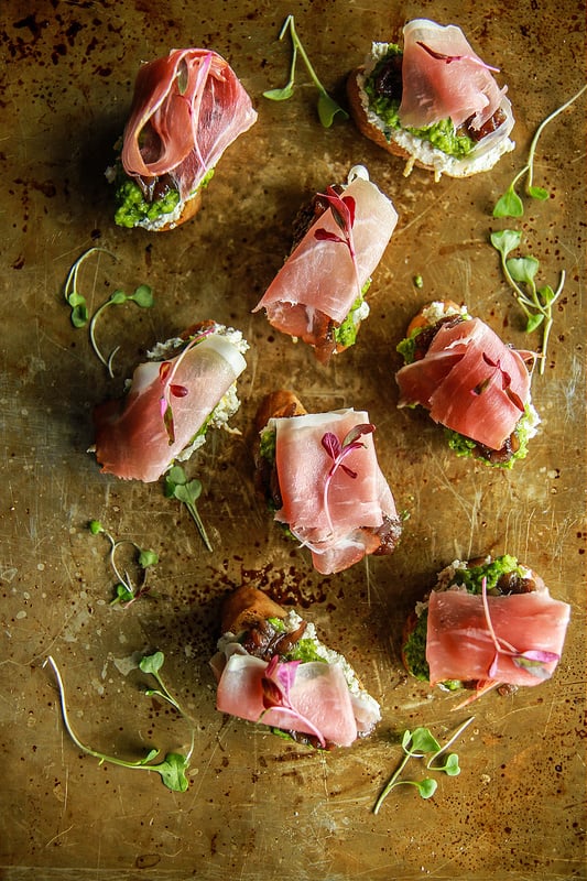 Ricotta, Pea Puree, and Caramelized Onion Crostini With Prosciutto
