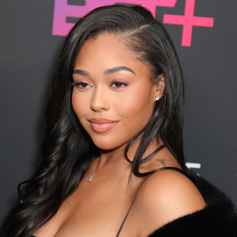 Jordyn Woods draws attention to her enviable hourglass figure in a floral  print dress on Instagram