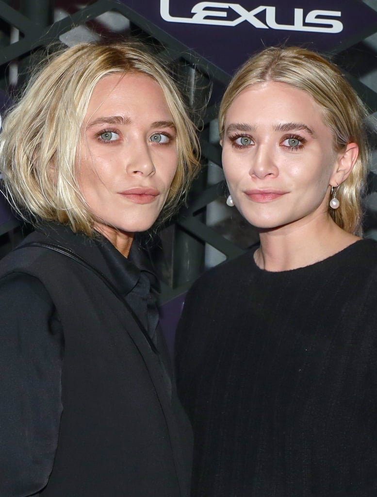 Later in 2013, the pair rocked on-trend pink eye makeup at the Lexus Design Disrupted Event. Mary-Kate also changed up her style by wearing her blond hair tucked into her outfit.