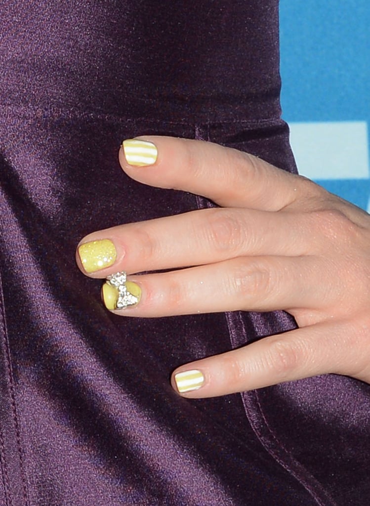 Zooey sported a 3D manicure at the 2012 Critics' Choice Awards that mixed a diamond bow with summery stripes. Her inspiration for the manicure was a vintage Victorian beach.