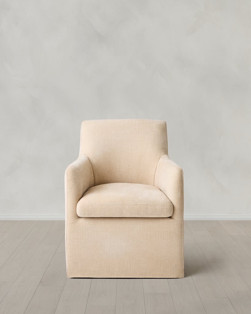 Quince Performance Linen Curved Back Dining Chair ($350)
 As part of Quince's elevated furniture line, we love the look of this upholstered chair. Designed to tuck neatly under your dining table, it features a removable slipcover for easy cleaning. The seat cushion is crafted from three layers of high-density foam, making it extra comfortable for those nights when you're lingering at the table.