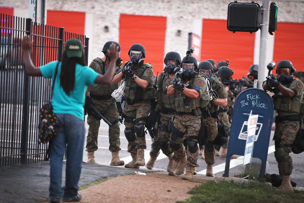 A woman encountered armed police on a Ferguson, MO, street.