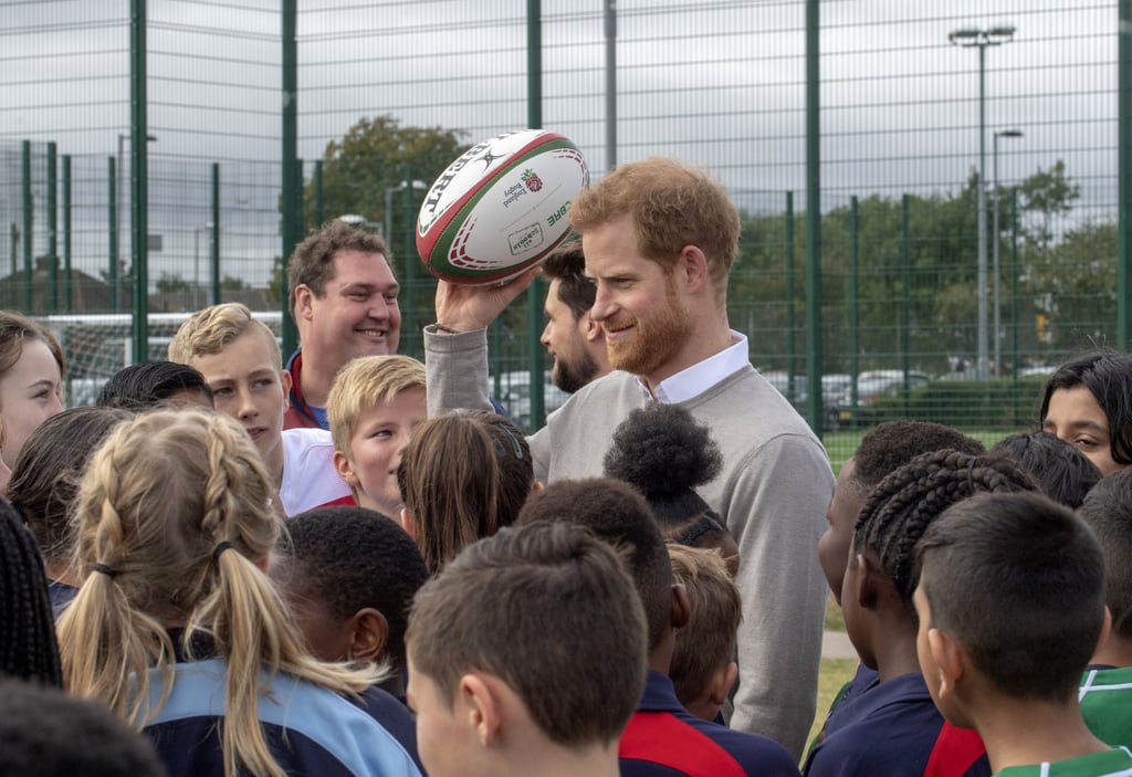 Prince Harry Hugs Kids at Lealands High School