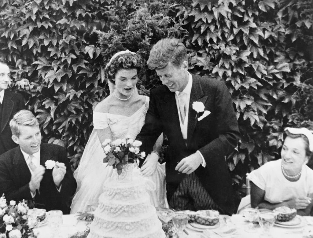 Their wedding cake was massive. The five-tiered cake, which was a gift from John's dad, Joseph P. Kennedy, was four feet tall and included a beautiful display of flowers.