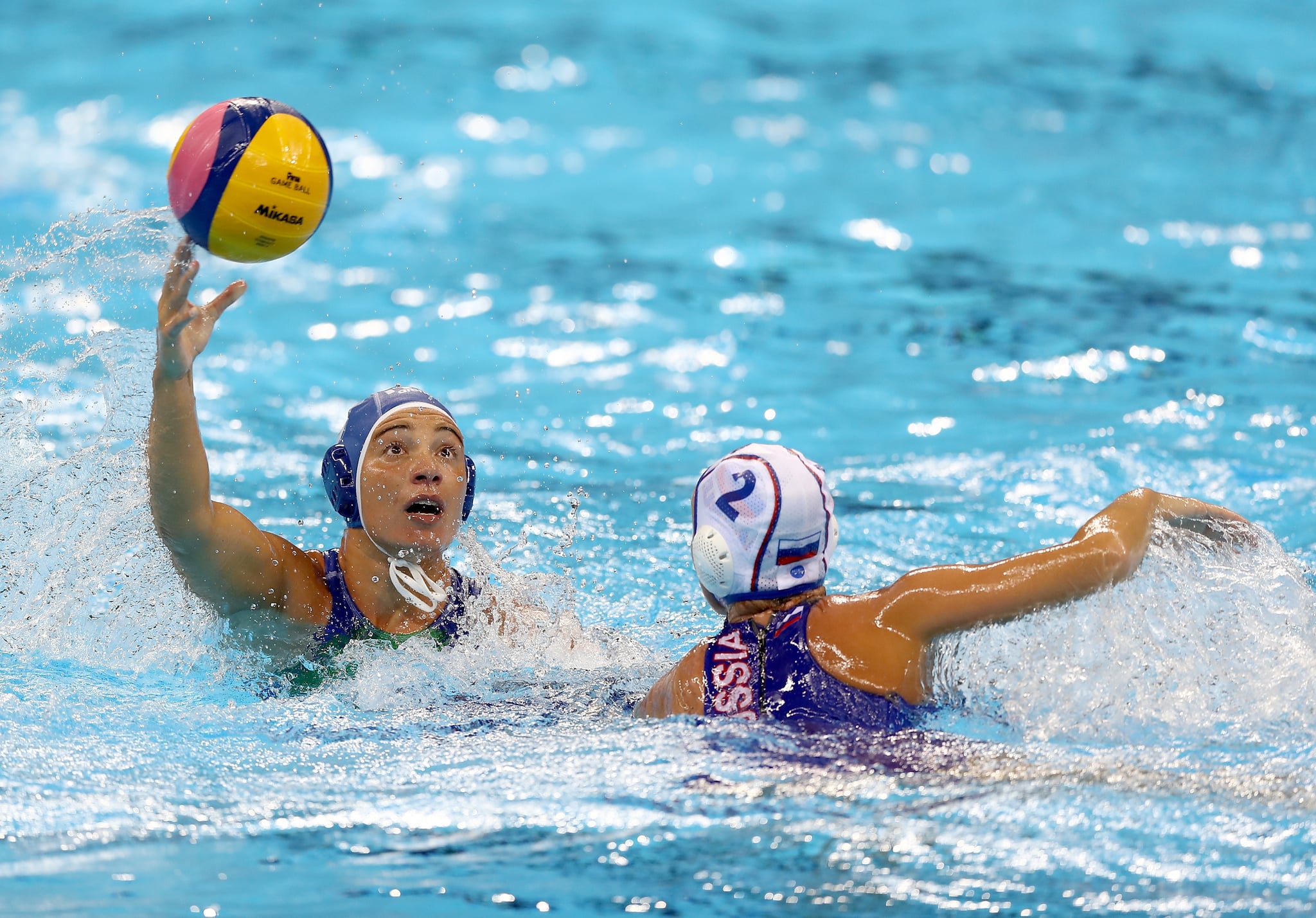 RIO DE JANEIRO, BRAZIL - AUGUST 17:  Roberta Bianconi #8 of Italy passes the ball as Ekaterina Lisunova #2 of Russia defends during the Women's Water Polo at Olympic Aquatics Stadium on August 17, 2016 in Rio de Janeiro, Brazil.  (Photo by Elsa/Getty Images)