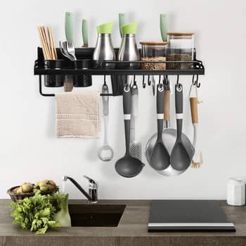 Set of black modern kitchen utensil hanging Stock Photo by