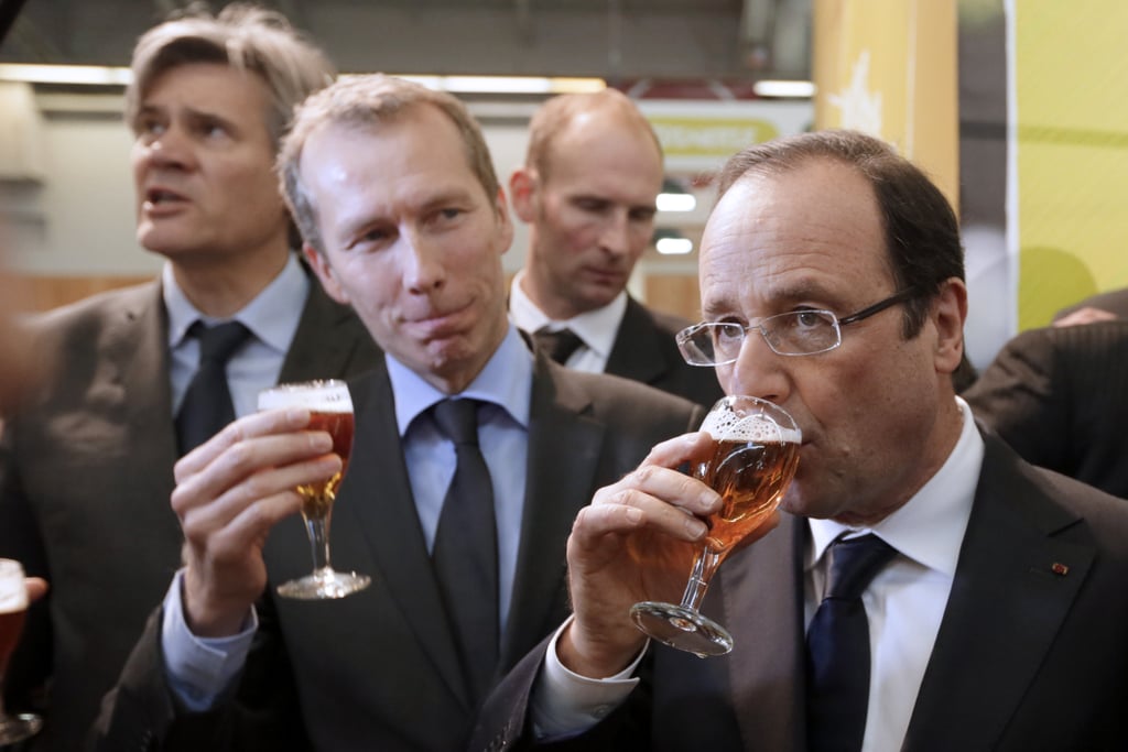 French President Francois Hollande drank a beer during an agriculture fair in Paris in 2013.