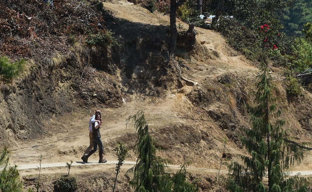 Will and Kate were spotted with their arms around each other as they walked the trail to a Buddhist monastery during their visit to Bhutan in April 2016.