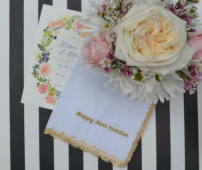 Have handkerchiefs embroidered with gold thread for a delicate favor.