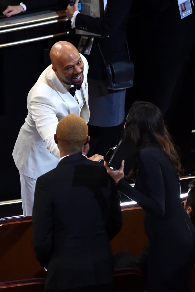 Common said hi to Pharrell Williams and his wife, Helen Lasichanh.