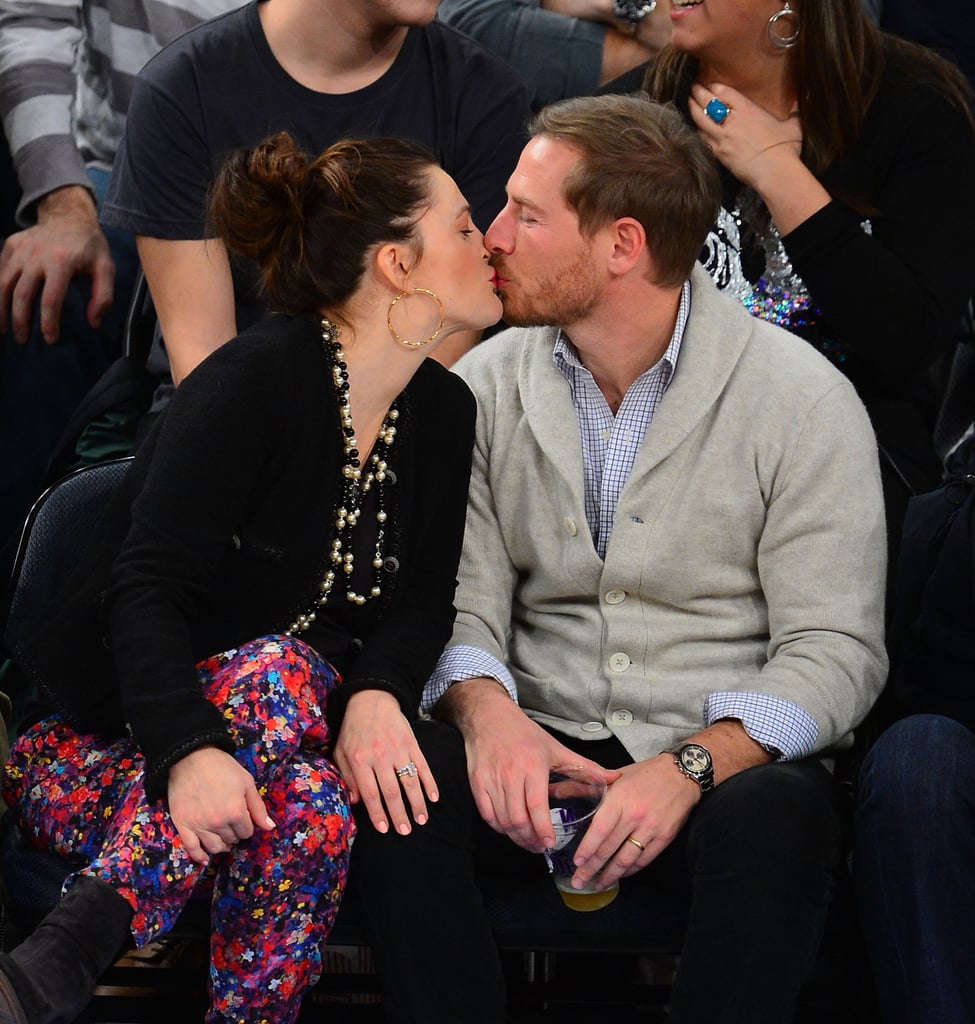 Drew planted a kiss on Will during a NY Knicks basketball game in January 2013.