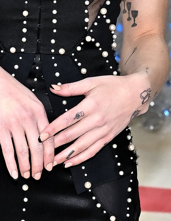 Phoebe Bridgers's Finger Tattoos