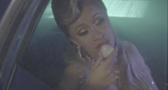 Cardi B Uses Eos Lip Balm in "Bartier Cardi" Music Video
