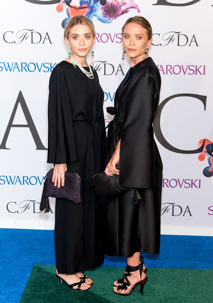 Twinning combo: At the 2014 CFDA awards, the duo covered up in demure dresses. 

Ashley added pearls for an extra hint of sophistication.
Mary-Kate kept her outfit from looking dowdy by adding sexy lace-up stilettos.