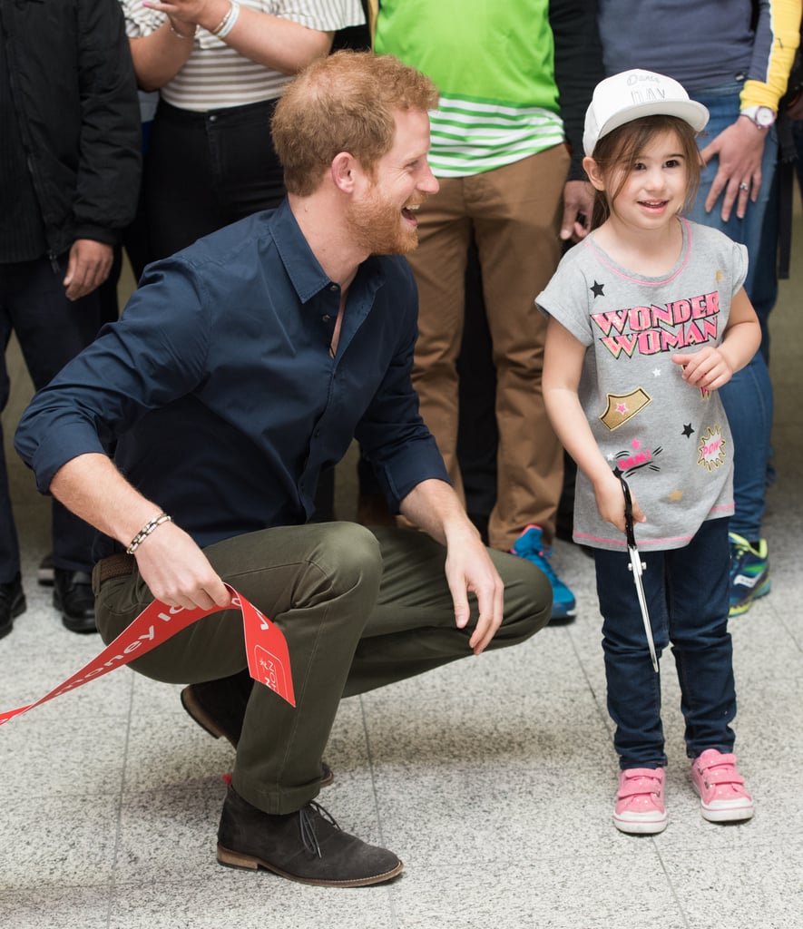 Prince Harry showed off his signature charm when he attended the official opening of the Virgin Money London Marathon Expo on Wednesday. The British royal had an adorable photo op with a little girl named Mellisa Howse, who was wearing a cute Wonder Woman shirt, as he helped her cut the red ribbon. He even put his fun uncle skills on full display as he applauded the 5-year-old's efforts. While her father admitted she probably didn't know who Harry was, she definitely looked a little starstruck as he leaned down and held her hand. 
The sweet outing comes just a few days after his revealing interview with The Telegraph for its Mad World podcast. Aside from opening up about being a godfather, he also talked about the possibility of starting a family of his own, saying that he would "love to have kids." Perhaps his blossoming romance with Meghan Markle is to blame. 

    Related:

            
            
                                    
                            

            38 Times Prince Harry Was Out-of-Control Cute With Kids