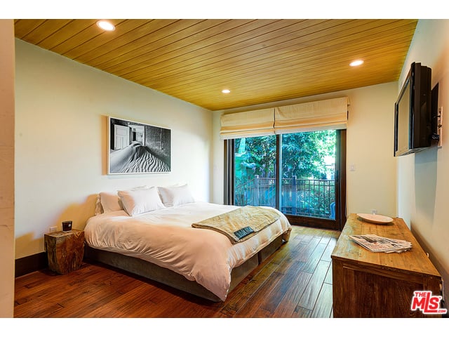 Hardwood floors give all the bedrooms a sleek, modern feel.