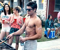 It accompanies Efron while he grills.