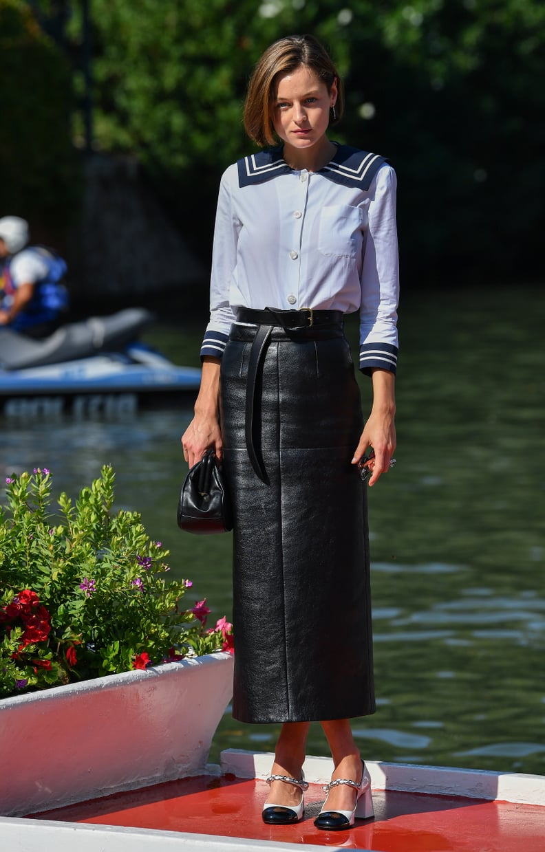 Emma Corrin Wears a Sailor Shirt and Leather Skirt