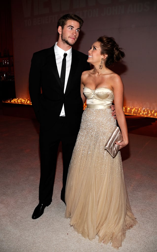 Miley Cyrus and Liam Hemsworth had a look of love at the Elton John AIDS Foundation Academy Award party in March 2010.