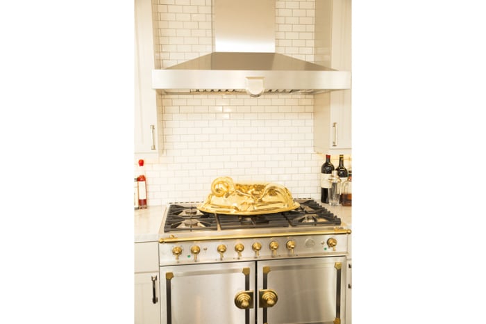 No expense was spared in the kitchen, where a La Cornue brass range (which sells in the five-figure range) is just one of the luxe amenities. 
Source: Bradley Meinz for Rodeo Realty