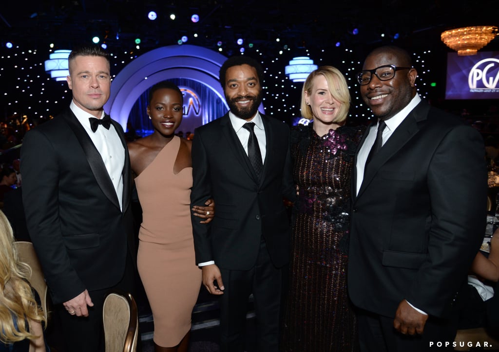 The cast of 12 Years a Slave posed together with director Steve McQueen inside the Producers Guild Awards.