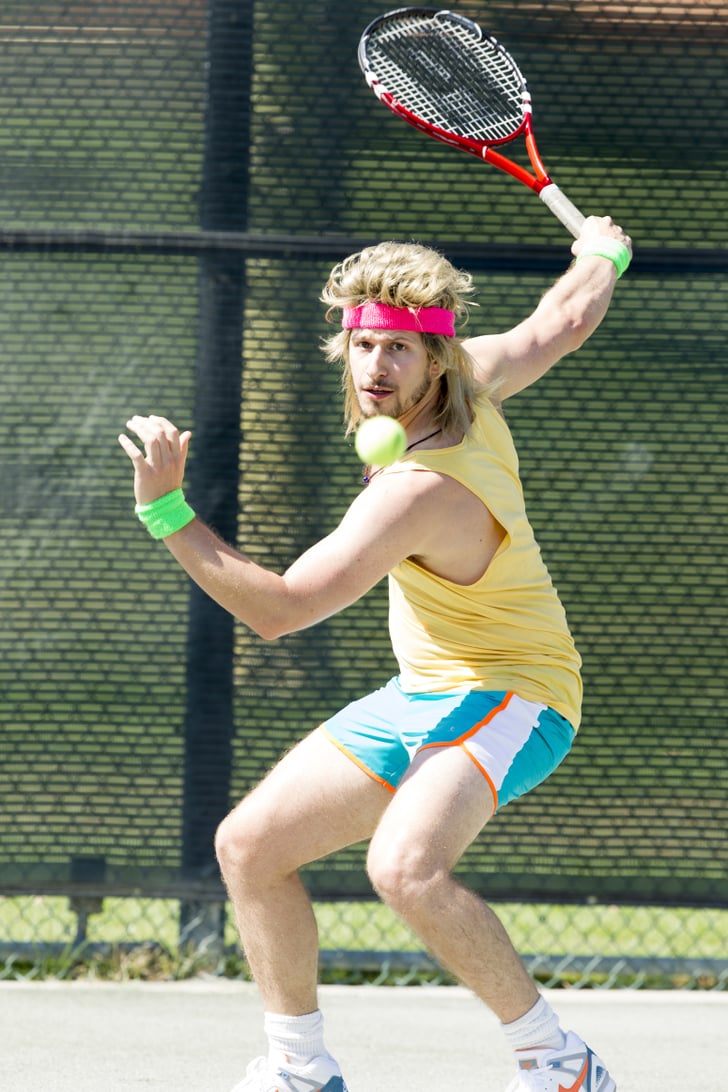 Andy Samberg (and his wig) plays Aaron Williams.