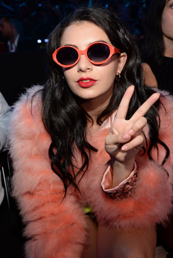 Later on in the evening, Charli XCX slipped on these funky peach sunglasses to complement her fur coat.