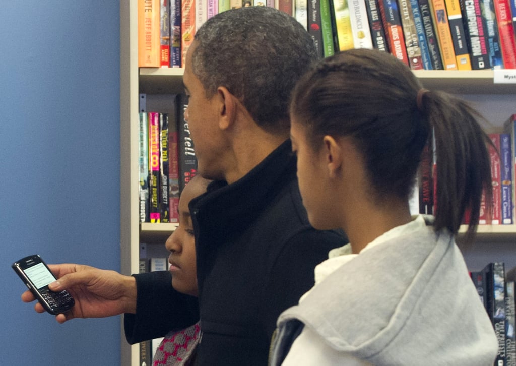 Scrolling through his BlackBerry (again) in 2012.