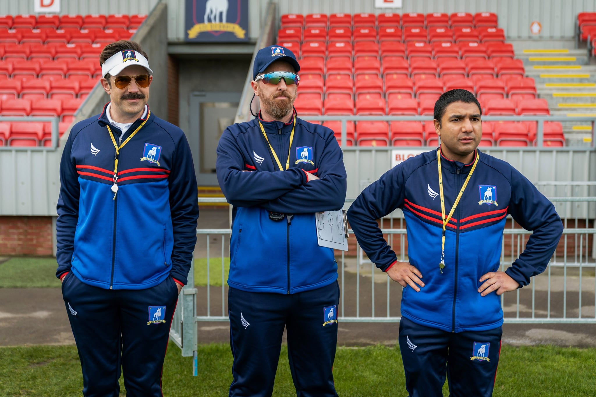 TED LASSO, from left: Jason Sudeikis, Brendan Hunt, Nick Mohammed, (Season 2, ep. 202, aired July 30, 2021). photo: Colin Hutton / Apple TV+ / Courtesy Everett Collection